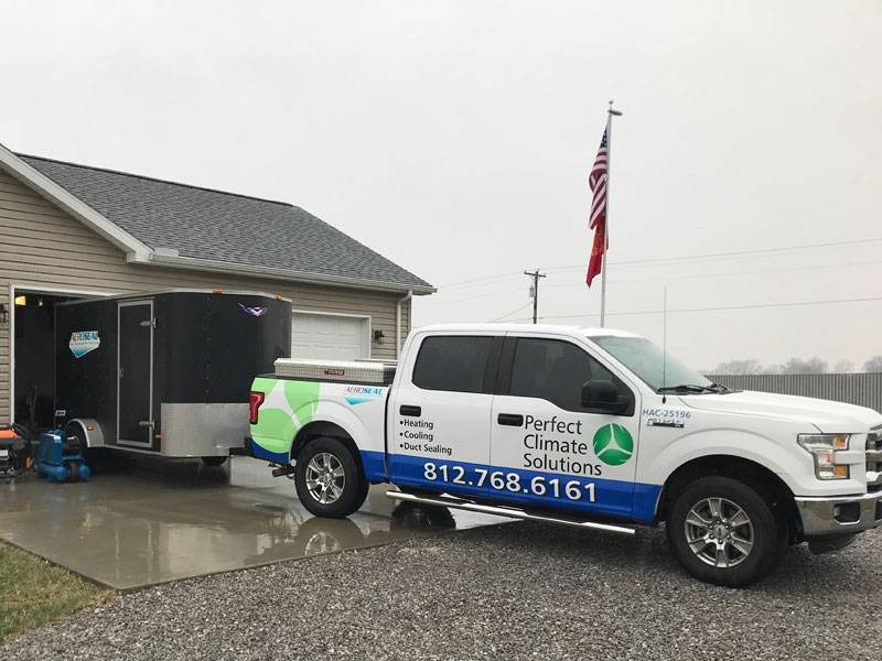 perfect climate solutions truck outside of a house