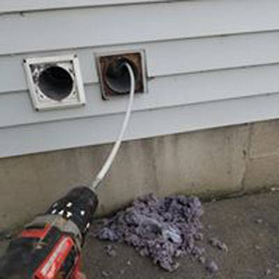 PCS dryer vent being cleaned