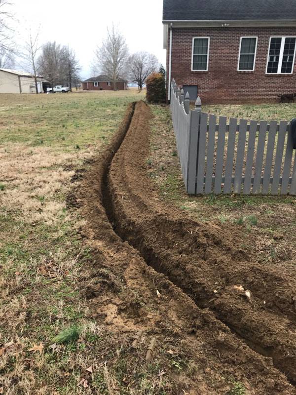 gas line trench on the side of a house